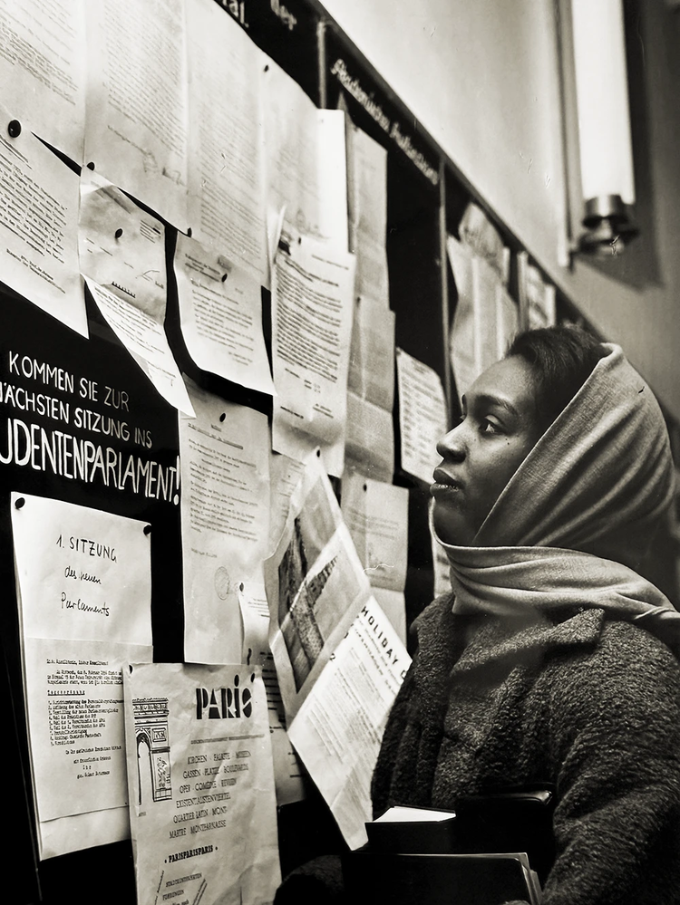 Gwendolyne studying the bulletin board at Heidelberg University